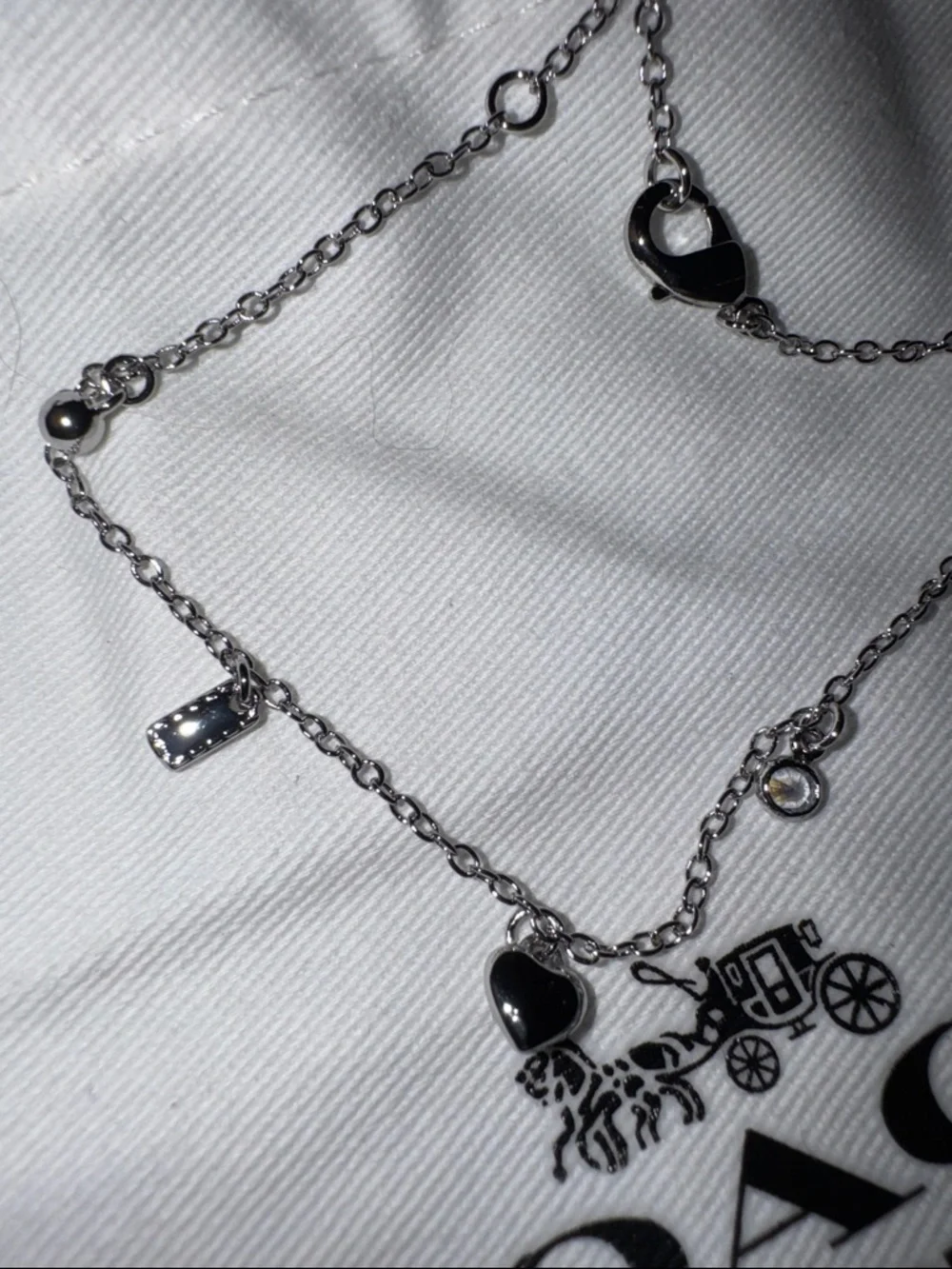 COACH Silver-Tone Charm Bracelet with Heart & Logo Charms